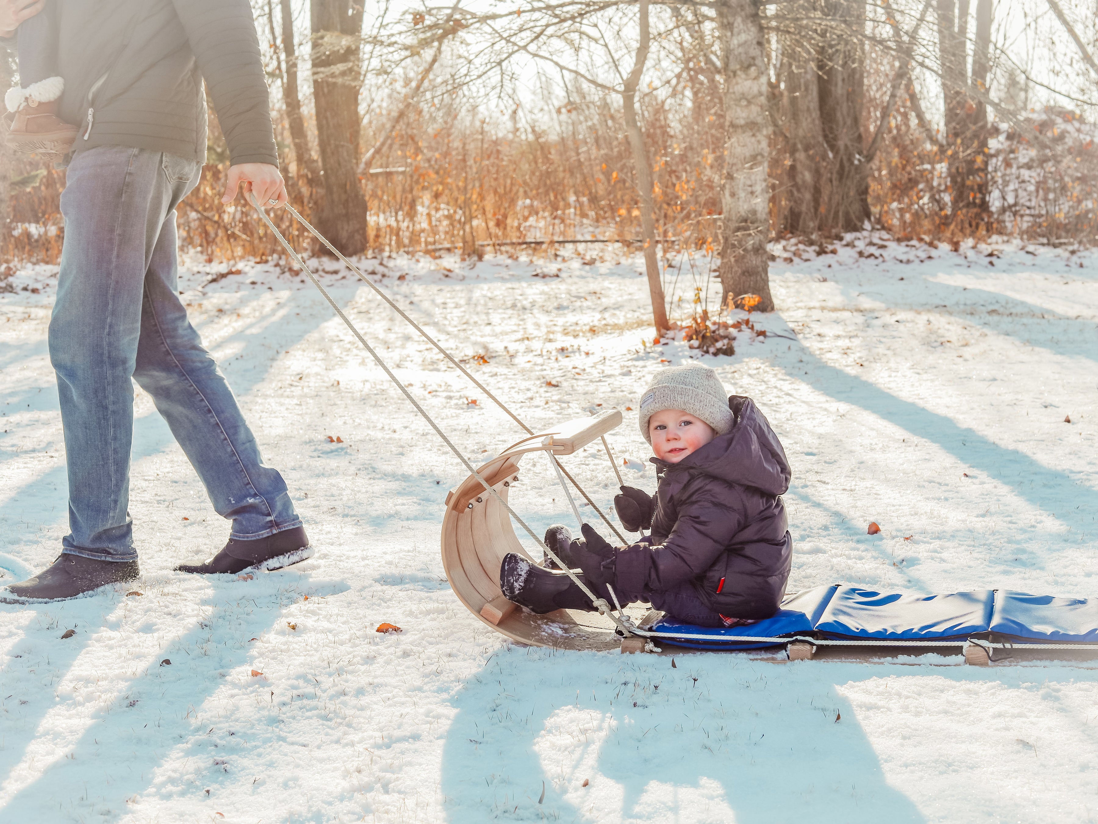 child on toboggan