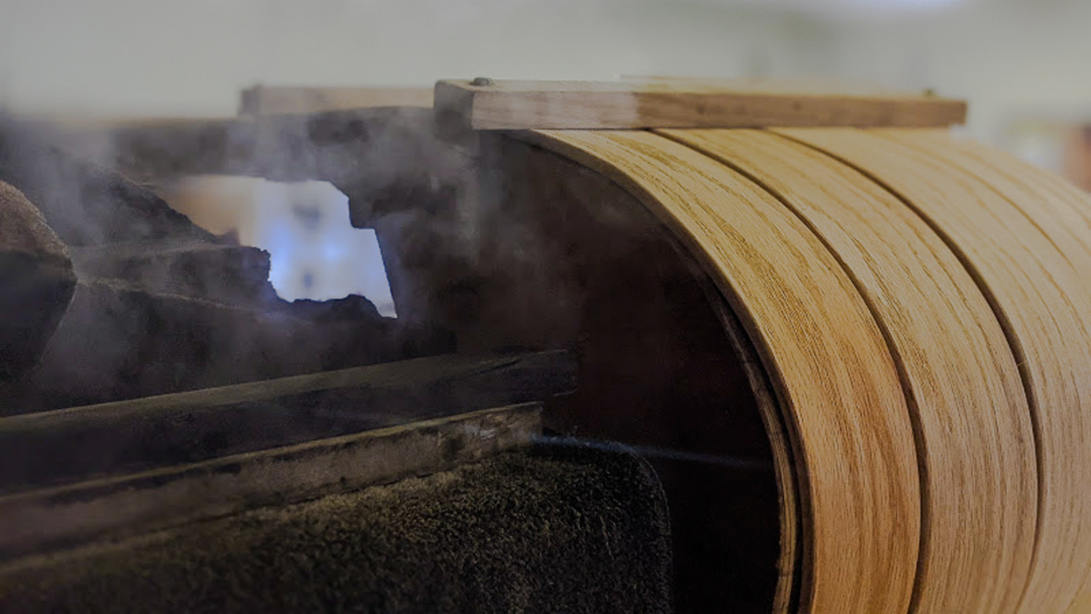 toboggan sled being steamed in woodshop northern toboggan minnesota family owned company